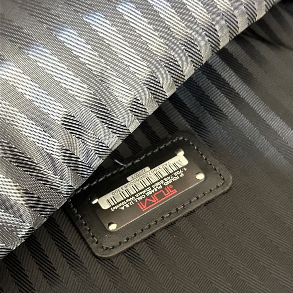 TUMI Striped Black and Gray Travel Bag